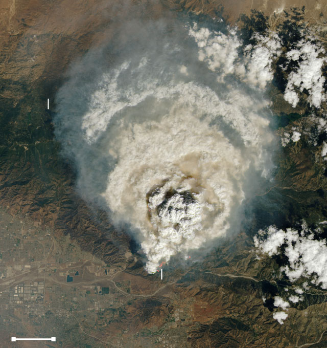 Satellite image shows a large cloud of smoke over Big Bear Lake and Lake Arrowhead, just northeast of San Bernardino and Redlands.