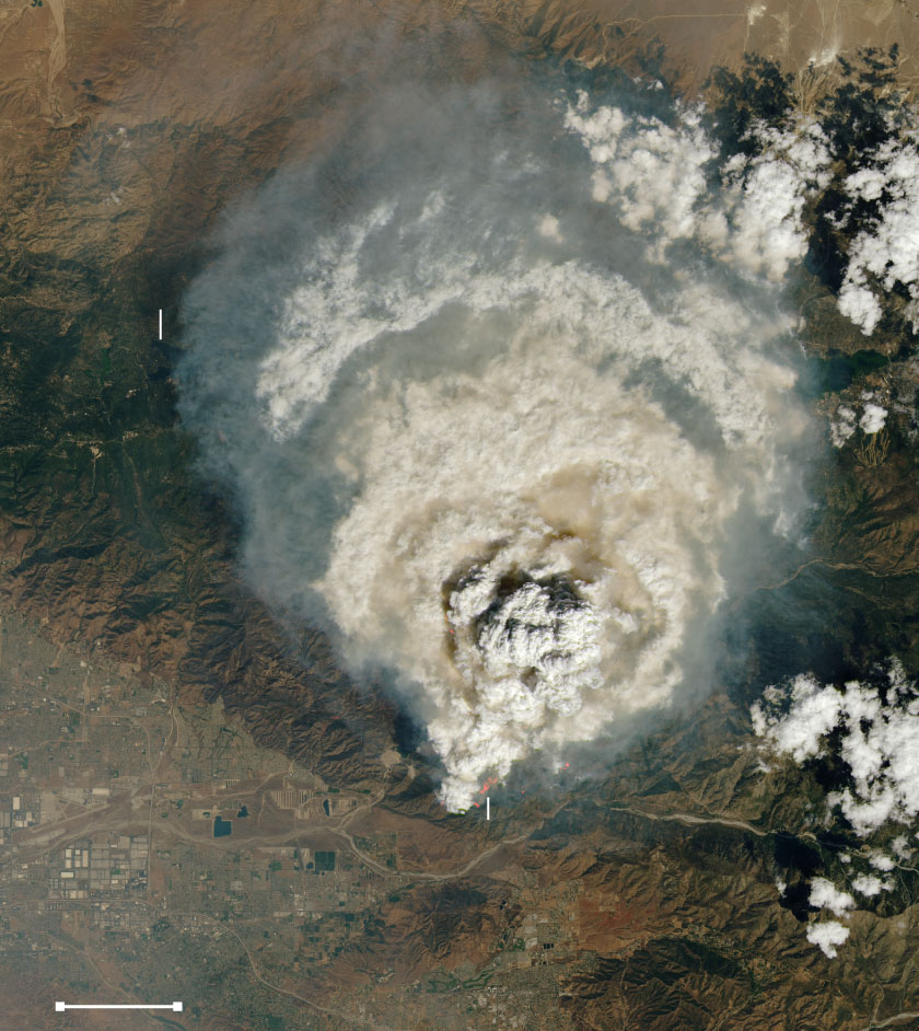 Satellite image shows a large cloud of smoke over Big Bear Lake and Lake Arrowhead, just northeast of San Bernardino and Redlands.